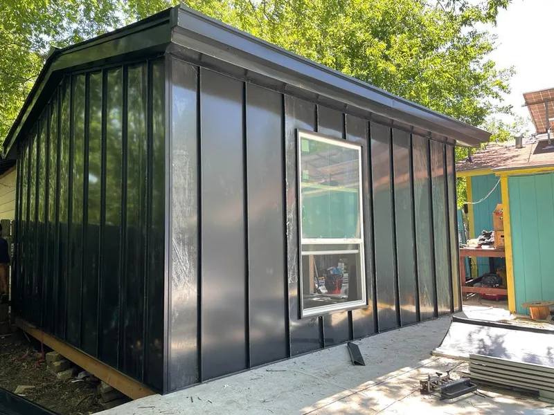 Black standing seam metal wall panels for Roof Inspection in Joplin